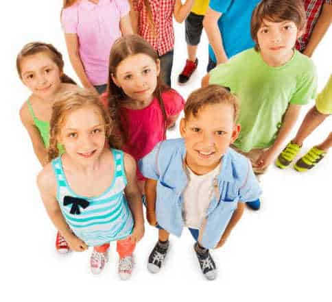 Group of kids in casual clothes looking up at the camera.