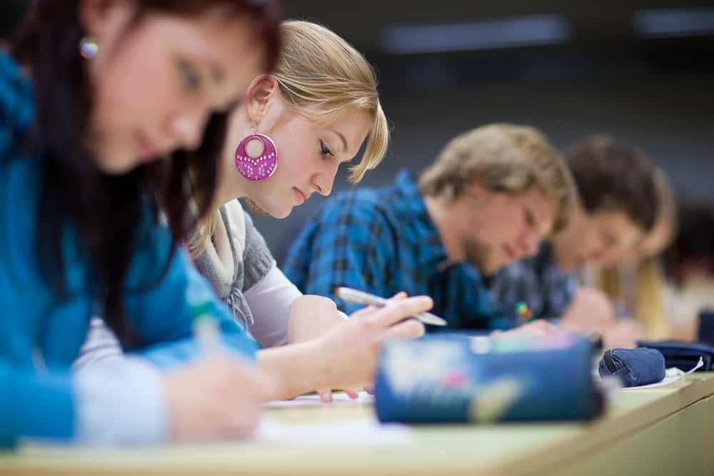 College students studying in a row, faith in college 