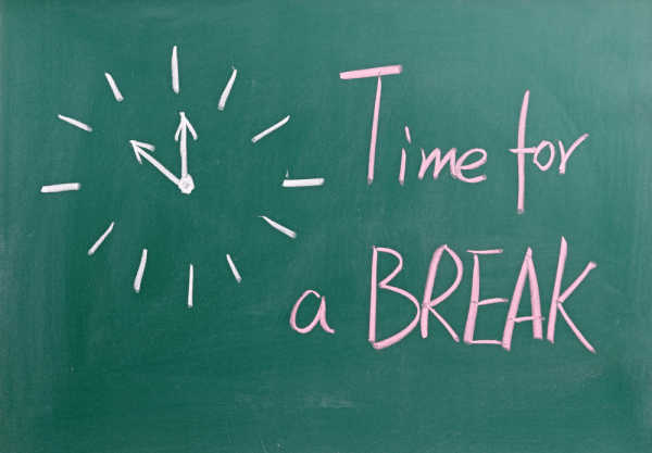 Mom ready to quit homeschooling has drawn a clock with the words time for a break. 