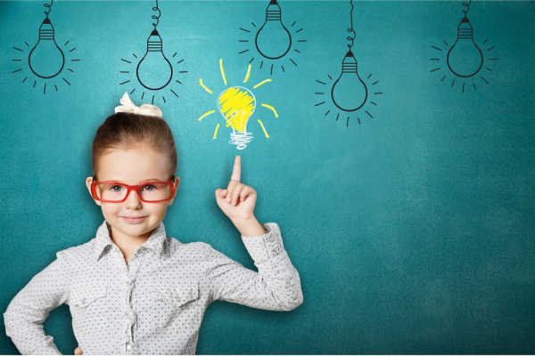 Turquoise blue background with hand-drawn lightbulbs hanging from the top.  A little girl in red glasses and a polka dot oxford shirt is pointing up at one light bulb that is colored yellow and white as if it is on.  This illustrated the memorize the Books of the Bible with an LED light bulb. 