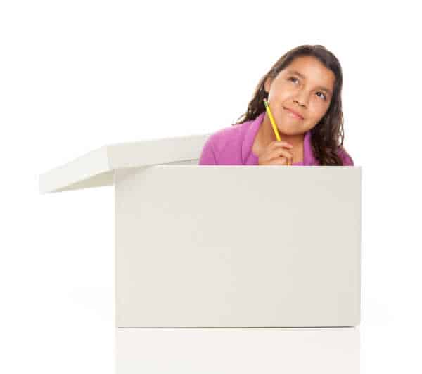 Attractive Young Ethnic Female with Pencil Popping Out and Thinking Outside The Box Isolated on a White Background. raise kids to be entrepreneurs is an out of the box idea. 