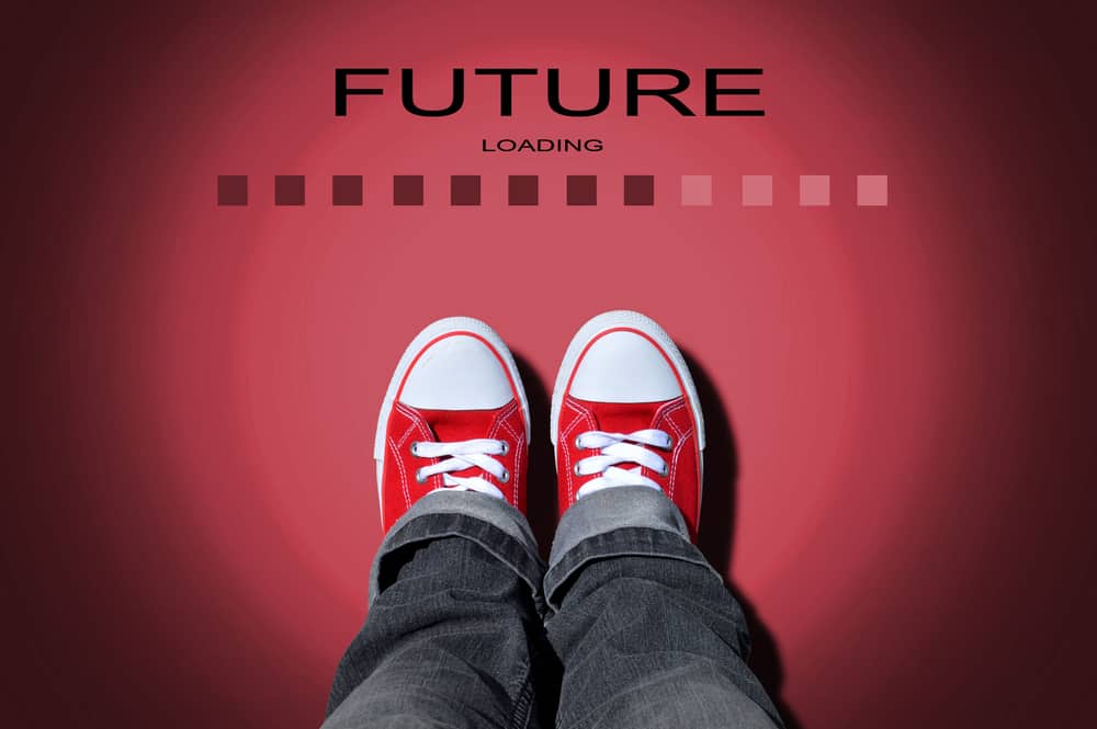 red shoes with message: future loading - creative red keds like an entreprenuer - entreprenuer vs employee mindset - raise kids to be entrepreneurs