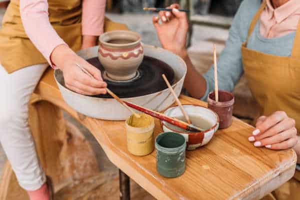 Just like with pottery in the Bible this woman and daughter are painting their pottery to make it beautiful. 