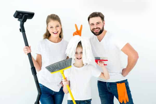 Mom, dad, and little girl - all cleaning the house so that there is no unappreciated mom. 